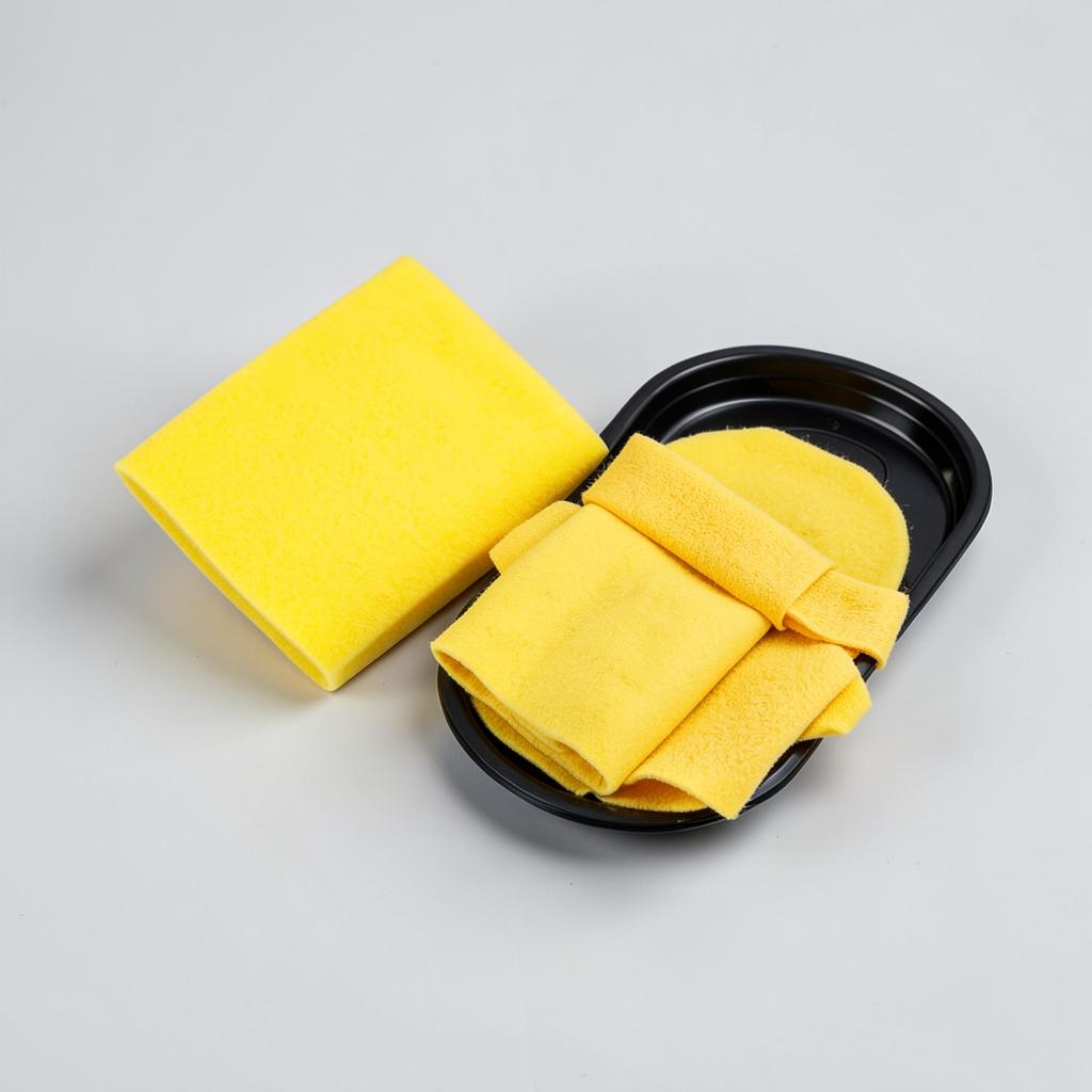 Kit de derrame con paños y salchichas absorbentes junto a tambores